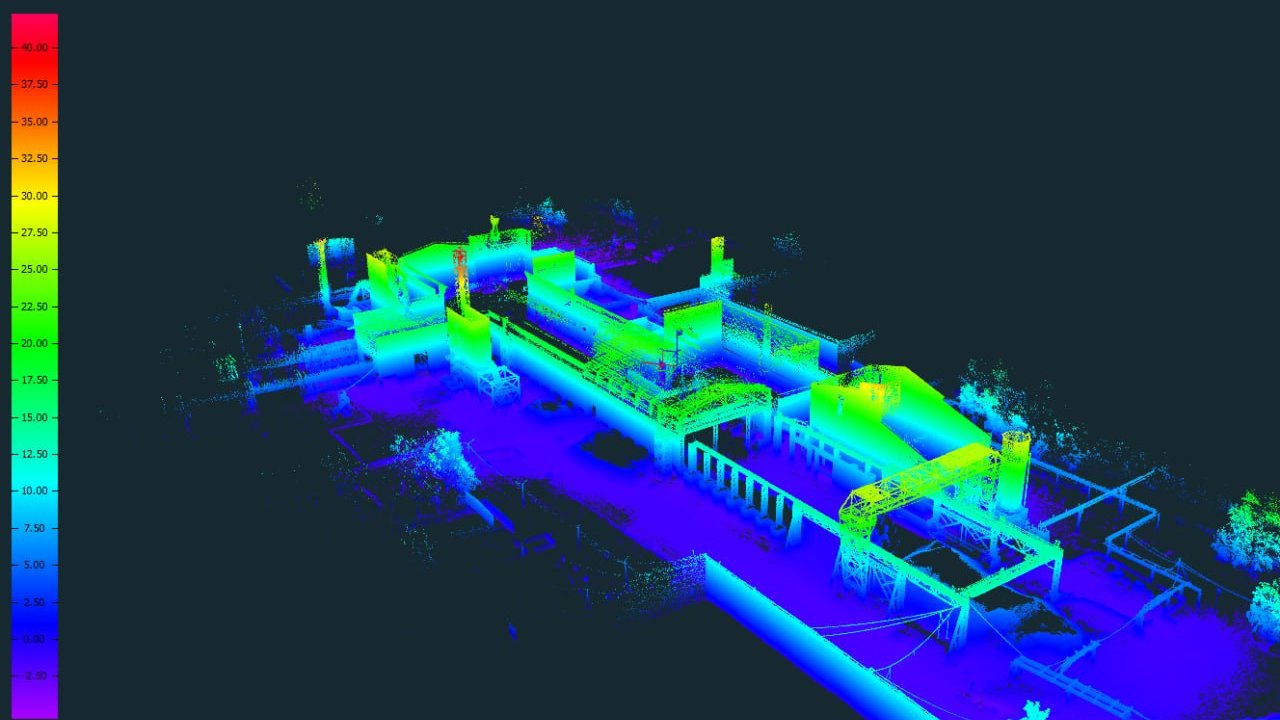 Revit BIM model overlaid on a registered LiDAR point cloud of a commercial building interior